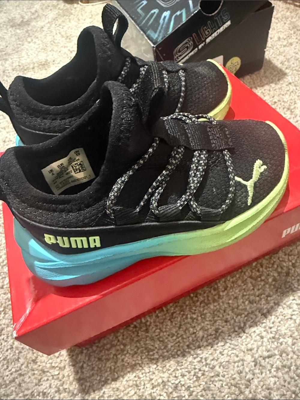 Puma Kids Black Sneakers with Blue and Lime Gradient Sole